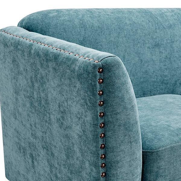 Teal fabric armchair with studded trim on armrest and backrest