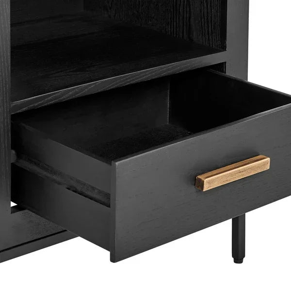 Black wooden furniture drawer with gold handle and open shelf above