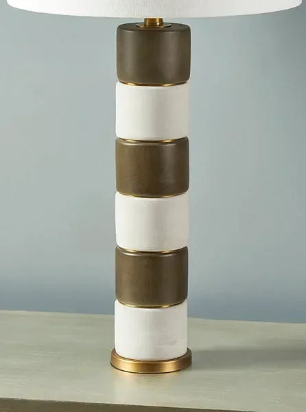 Stacked ceramic table lamp with alternating brown and white blocks on gold base