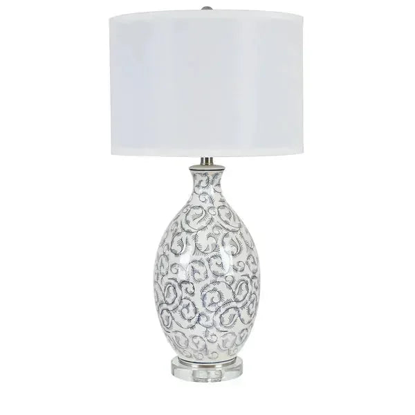 Ceramic table lamp with silver swirl design and white drum shade