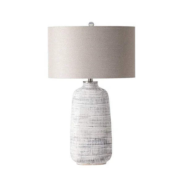 textured ceramic table lamp with light grey cylindrical fabric shade
