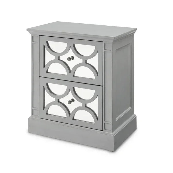 Grey mirrored bedside table with geometric drawer fronts and two metal knobs