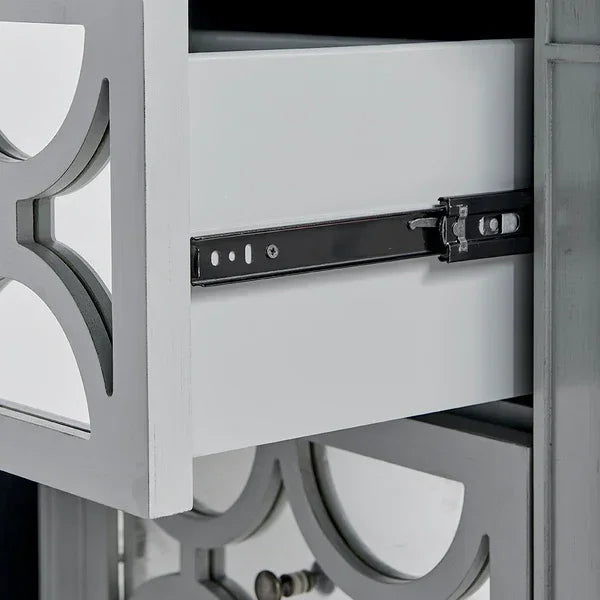 Closeup of wooden drawer with mirrored panel design and metal sliding rail