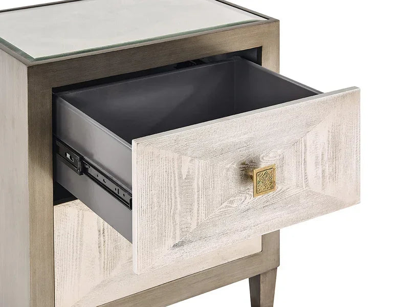 Wooden bedside table with mirrored drawer front and gold square handle, open drawer view