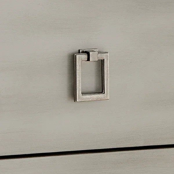 Brushed nickel square drawer handle on light grey wooden furniture surface