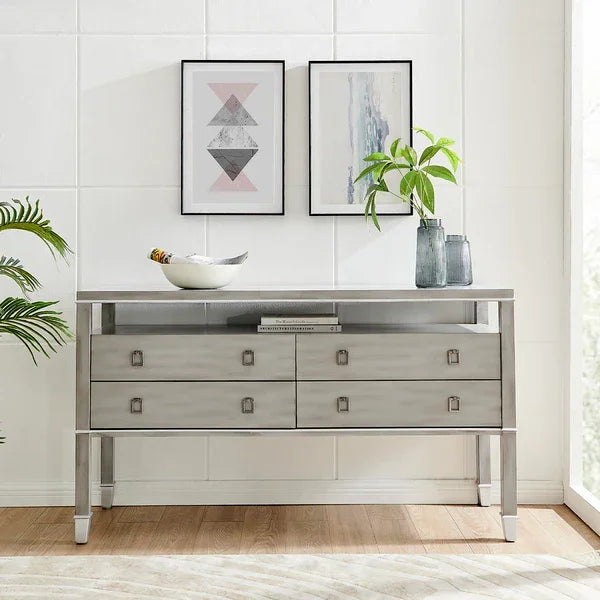 Grey wood sideboard with four drawers, decorated with plant, bowl, and framed wall art