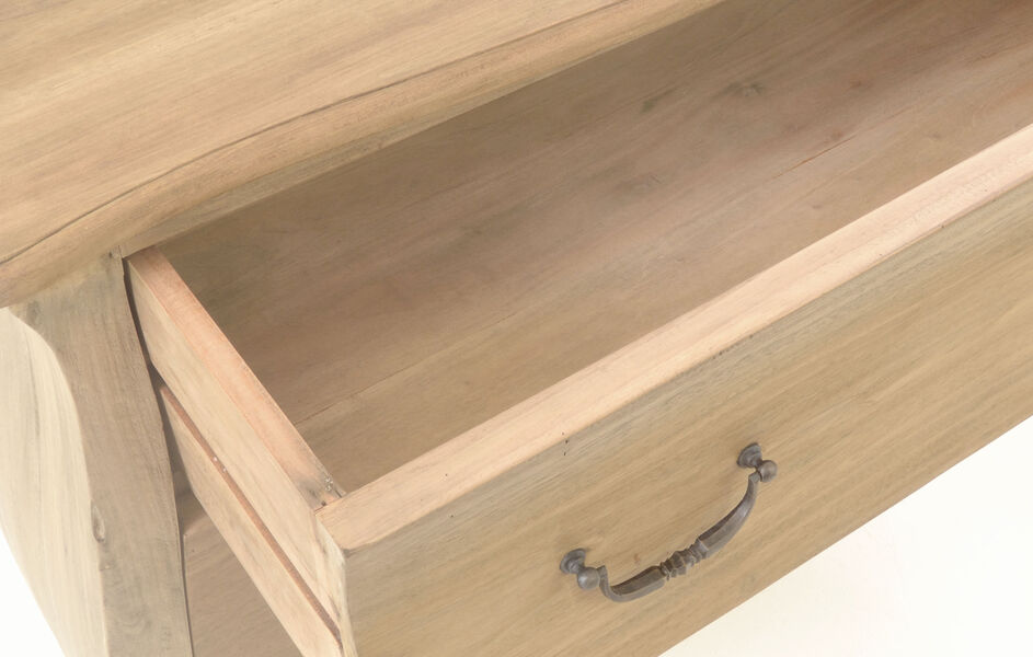 Light wooden drawer partially pulled out with ornate metal handle