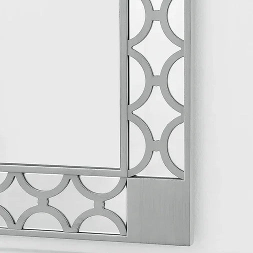 Silver wall mirror with geometric metal frame and modern design
