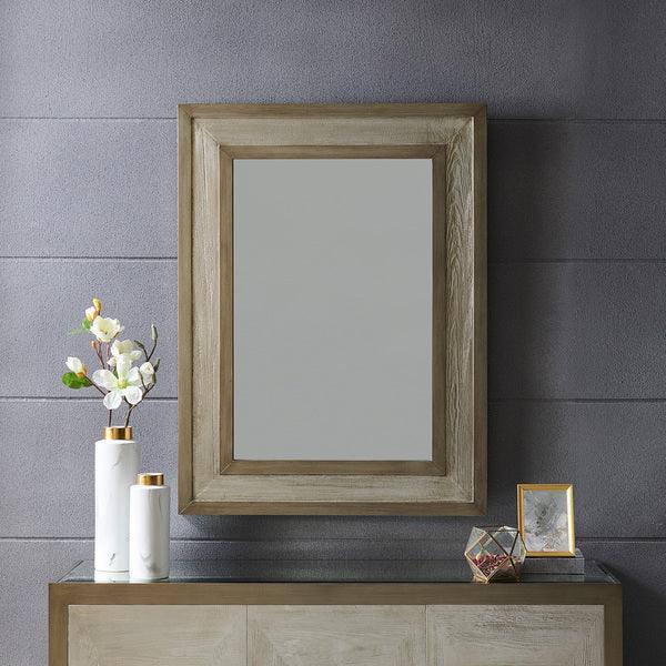 Rectangular wooden framed wall mirror above sideboard with decorative vases and art