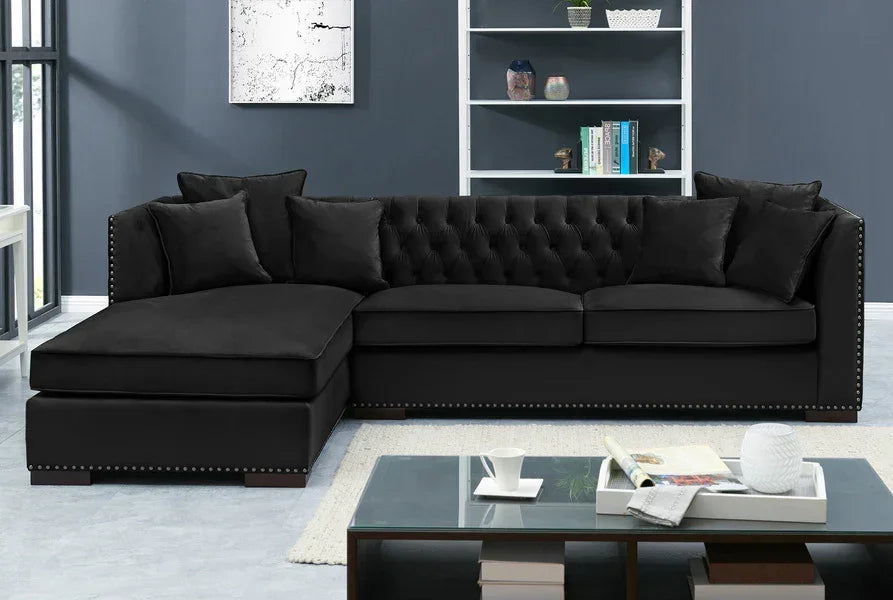 black velvet corner sofa with tufted backrest and nailhead trim in modern living room