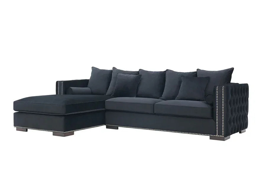 Black corner sofa with chaise, tufted armrests, nailhead trim, and scatter back cushions