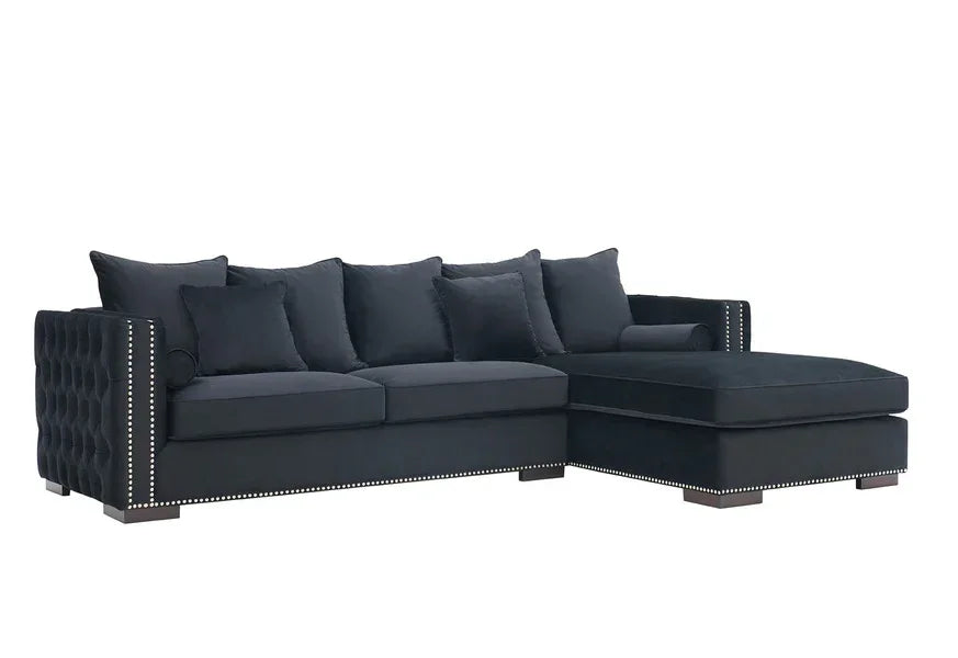 Black corner sofa with studded arms, tufted back, and matching cushions on white background