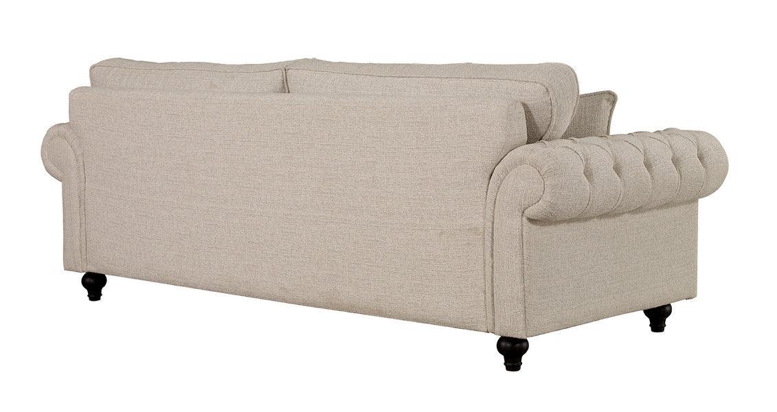 Beige fabric sofa with tufted arms and back, shown from rear angle on dark wooden legs