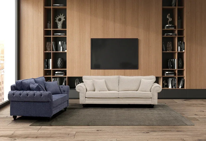 Blue fabric sofa and cream fabric sofa in modern living room with wooden wall and shelving
