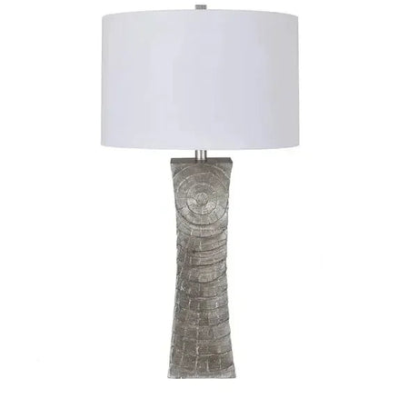 Grey textured column table lamp with a circular wood-grain pattern and white drum shade, front view