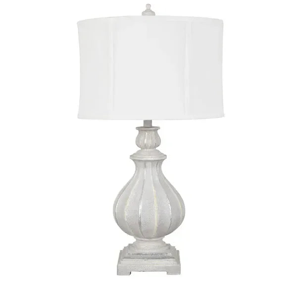 White table lamp with sculpted base and round fabric shade