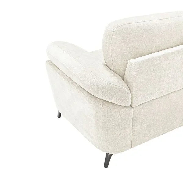 Light beige fabric sofa corner with padded arm and backrest, metal legs visible
