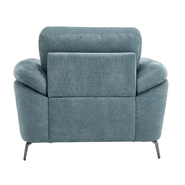 Blue fabric armchair rear view with angled metal legs and plump cushions