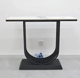 Modern console table with a rectangular marble top and black geometric metal base