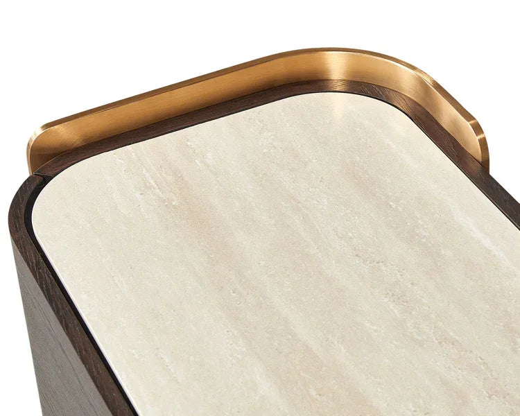 Marble top side table with curved brass edge and dark wood base, close up view
