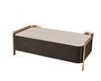Modern coffee table with light wood top, dark base and gold metal trim