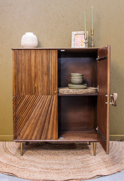 Wooden cabinet with two doors, one open showing two shelves with bowls and a basket