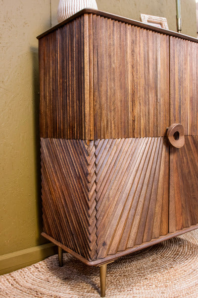 Wooden cabinet with intricate diagonal chip design and round handle on tapered legs
