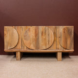 Wooden sideboard with four doors featuring oval patterns on a beige carpet