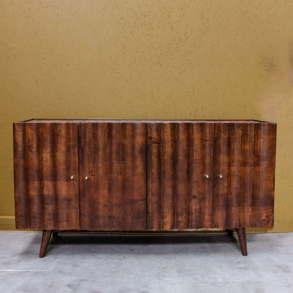 Wooden sideboard with four carved doors and tapered legs