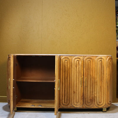 Wooden sideboard with two open doors showing internal shelving and capsule design panels