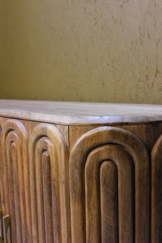 Wooden sideboard with capsule-shaped carved panels and smooth top