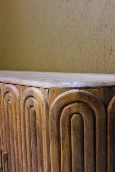 Wooden sideboard with capsule-shaped carved panels and smooth top