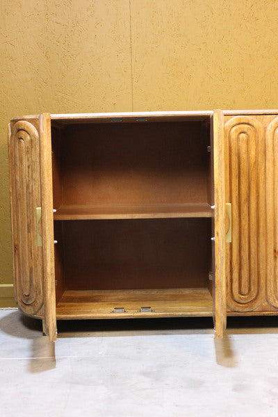 Open wooden sideboard showing inner shelves and curved smooth doors with handles