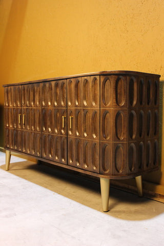 Wooden sideboard with oval tile carved design and rounded edges on angled legs
