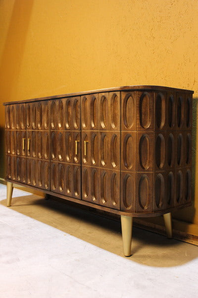 Wooden sideboard with oval tile carved design and rounded edges on angled legs