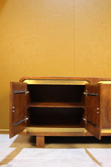 Open wooden cabinet doors showing inside shelf with yellow panel background