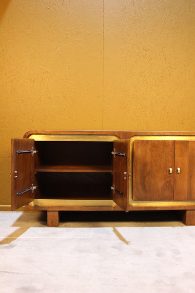 Open wooden sideboard with two doors and internal shelf against yellow wall