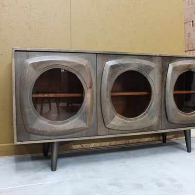 Wooden sideboard with curved framed glass doors on black legs