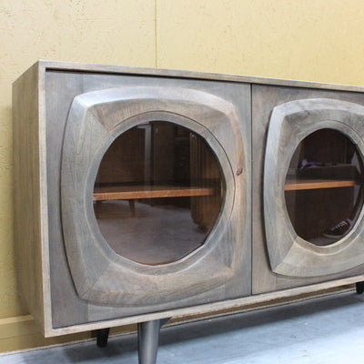Wooden sideboard with rounded glass door panels and tapered legs