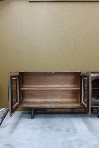 Wooden sideboard with open glass doors and single shelf inside