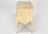 Side view of curved wooden chest with two drawers and cabriole legs