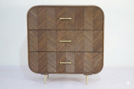 Sonar chest of 3 drawers in dark mango wood with layered chevron drawer fronts and gold-tone handles and legs, front view on plain background