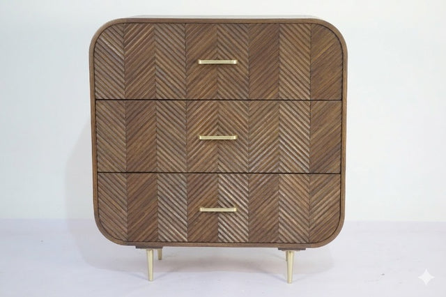 Sonar chest of 3 drawers in dark mango wood with layered chevron drawer fronts and gold-tone handles and legs, front view on plain background