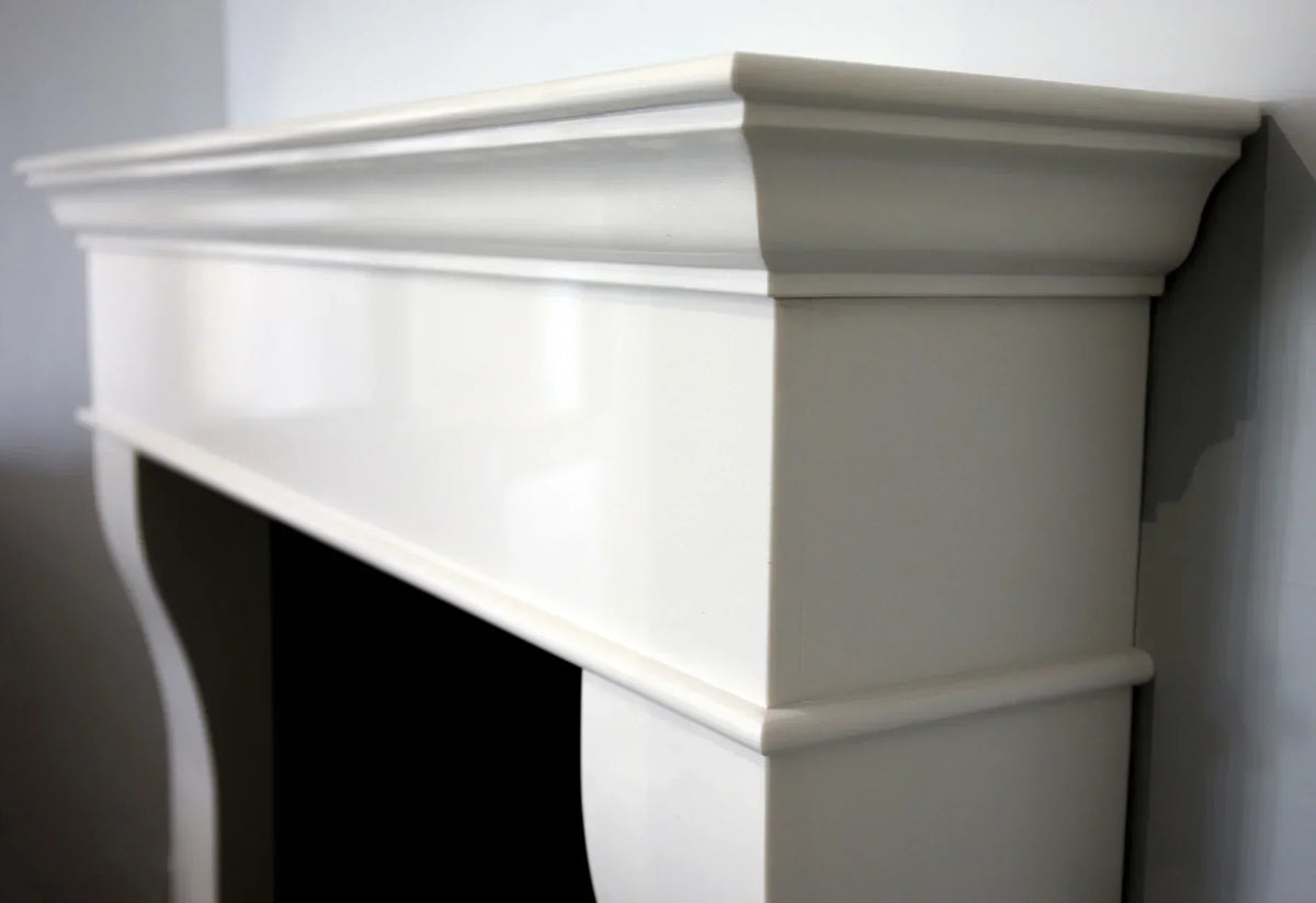 Plaza Polar White fireplace surround with smooth finish and detailed mantel edge