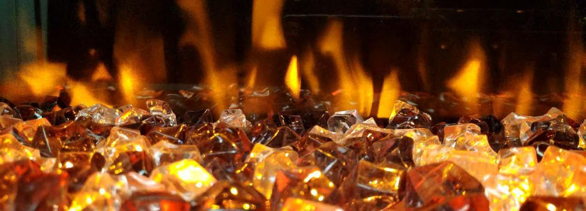 Electric fire with realistic flame effect over amber and clear crystal logs
