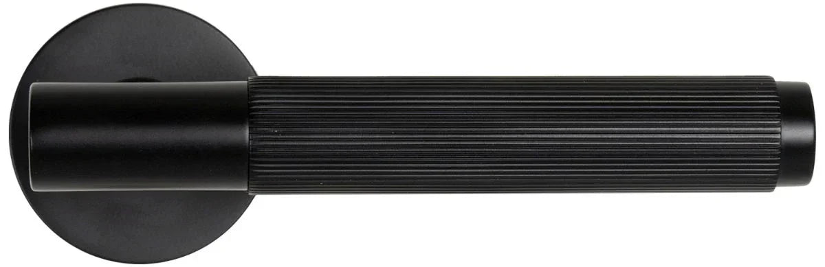 Matt black door handle with ribbed grip and round rose, horizontal side view
