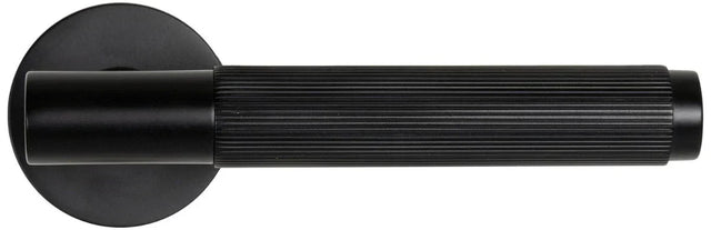 Matt black door handle with ribbed grip and round rose, horizontal side view