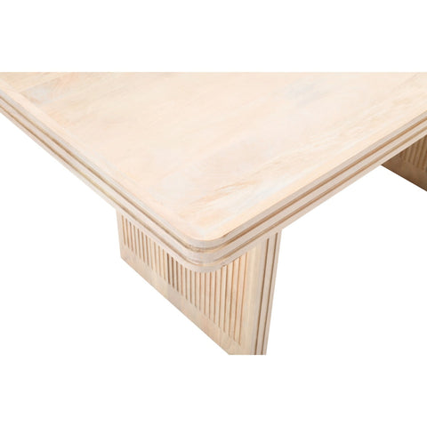 Hudson side table made of carved mango wood in a stylish setting