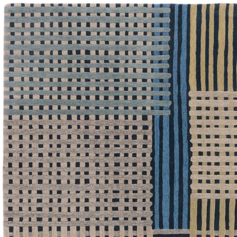 Patterned wool rug with geometric blue, beige, and yellow stripes and blocks