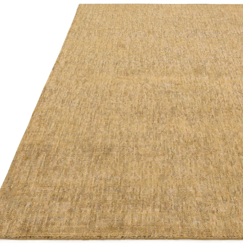 Natural flat weave jute rug with textured surface shown from a side angle